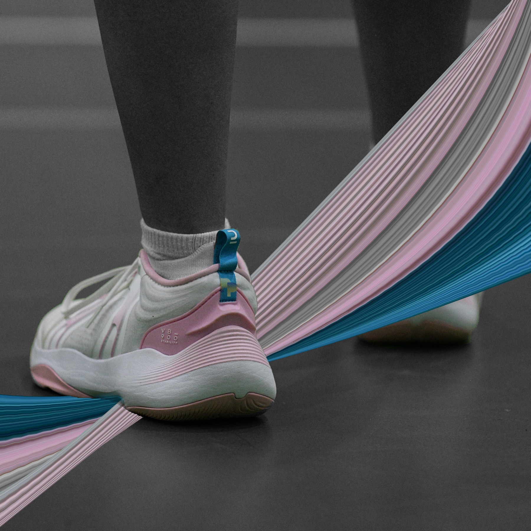 Court shoes in trans pride colours, a matching ribbon flowing across the floor