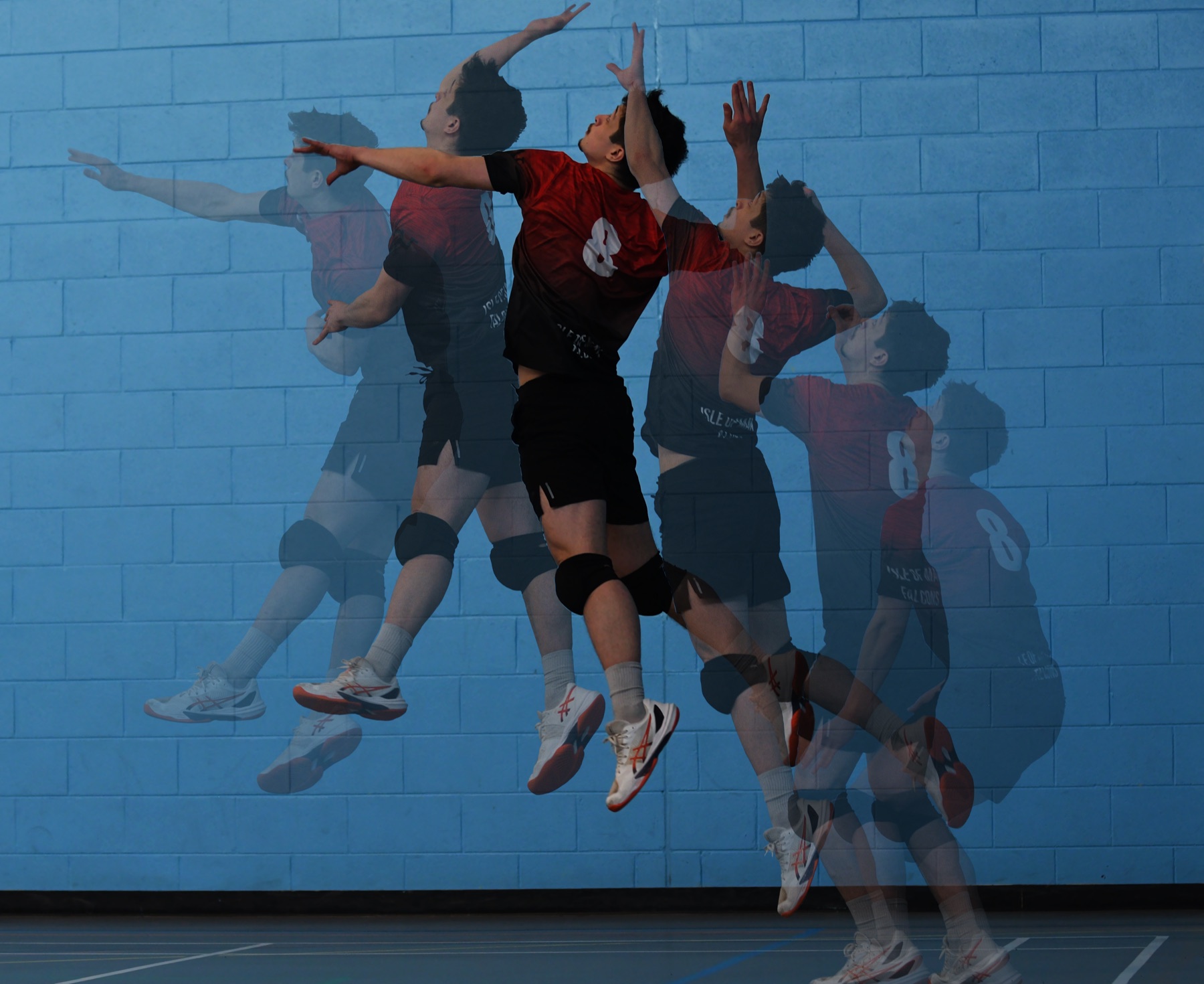Multiple-exposure of a spiker's approach and jump against a blue wall